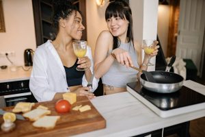 two women cooking together at-home date night ideas the reef jacksonville blog